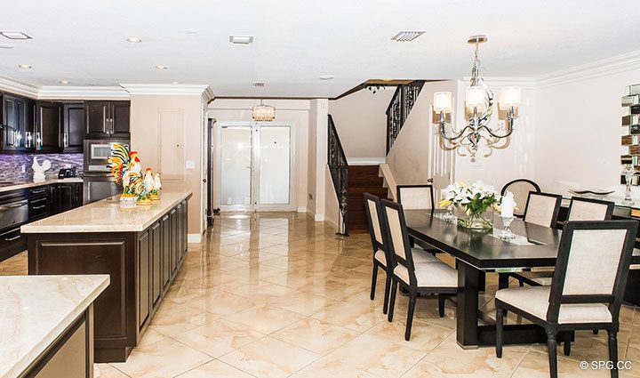 Dining Room and Kitchen in Residence 105 at La Cascade, Luxury Waterfront Condominiums in Fort Lauderdale, Florida 33304.