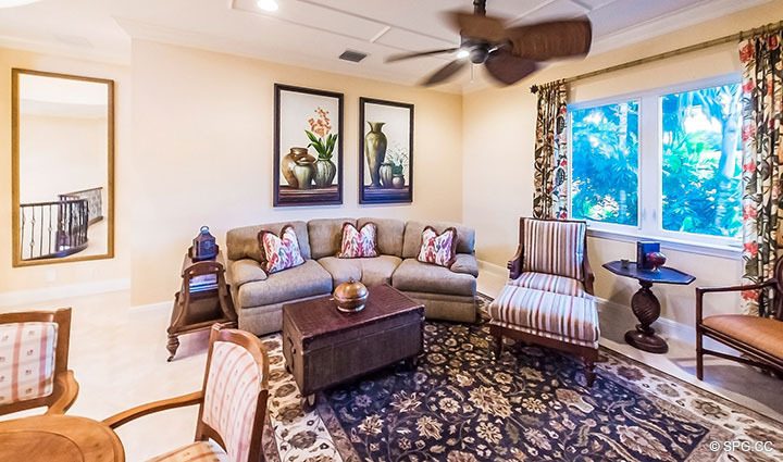 Den inside Luxury Estate Home, 11204 Orange Hibiscus Lane, Palm Beach Gardens, Florida 33418.